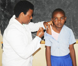 A girls gets her cervical cancer vaccine during the week-long campaign (Photo J Mbanda).