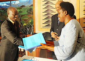 Dr Aisa Kirabo (R) hands over the RALGA presidency to her successor Justus Kangwagye (Photo T Kisambira)