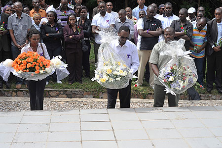 MINICOM Permanent Secretary Emmanuel Hategeka  (centre) and other ministry officials lay wreaths at Bisesero memorial centre in Karongi District (photo S Nkurunziza)