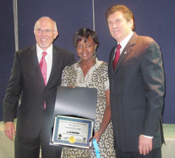 Aline Uwase (C) one of the Graduates poses with ICCC President, Dale Neill (R) and Rwanda BDC Managing Dirctor, Dr. John Mulford, yesterday. (Photo J Mbanda)