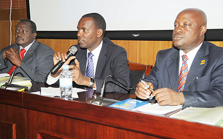 The Permanent Secretary in the Ministry of EAC  (C), Robert Ssali, addresses the EALA legislators.Looking on are EALA MPs Otieno Karan (L) and  Mike Sebalu. (Photo J Mbanda)