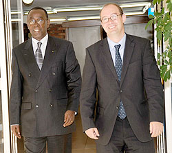 Prime Minister Bernard Makuza with the British Ambassador to Rwanda Benedict Llewellyn Jones after yesterday's meeting (Photo J Mbanda)