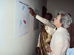 Princess Benedikt examines a map of Rwanda during her visit to the Nyanza palace