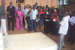 RwandAir staff listen to the guide at Ntarama Genocide Memorial site ( Photo G. Mugoya)