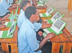 Pupils who have benefitted from the one-laptop-programme; President Kagame says that government has prioritised investing in ICT for a better future (File Photo)