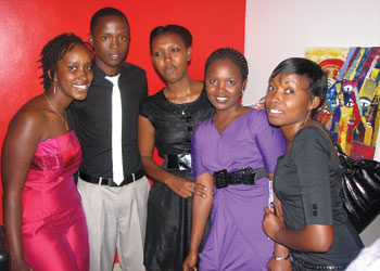 Akaliza Gara stands strong with her four employees; one secretary and three Web Developers.