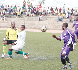 Kiyovuu2019s Faud Ndayisenga tries to get inbetween La Jeunesse goal keeper and defender. Kiyovu won the contest 1-0. (Photo T.Kisambira)