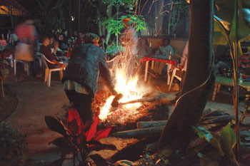 A reggae enthusiast makes bonfire to shed of a cold night