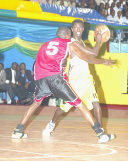 Fiston Muhire (with the ball) tries to shield off a Burundi player during the 2008 Zone 5 Championship. (File photo)