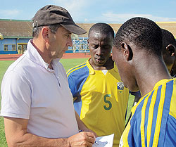 Richard Tardy explaining some thing to his players after an intensive workout at Amahoro Stadium. (File photo)
