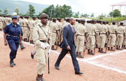 Mary Gahonzire, the Commissioner General of Prisons with Minister Fazil Harerimana, having a guard of honour (Photo T.Kisambira).