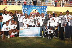 APR Players and Team Officials with their League trophy and 10m  frw cheque.(Photo / T. Kisambira).