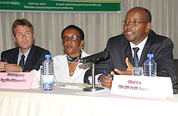 Minister James Musoni (R) speaks at the launch of the 2010 Bribery Index. With   him are Transparency Rwanda Chairperson Marie Immaculee Ingabire (C) and William Atkins from Norwegian Peopleu2019s Aid. (J Mbanda)