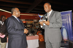 Julien Nkogve Bekale (left), Gabonu2019s Minister of Transport with Albert Nsengiyumva, Rwandau2019s Minister of Infrastructure during the launch of the RwandAir Libreville route (Courtesy photo)