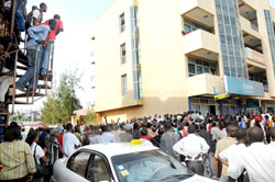 Members of the public scramble to pay registration fees for the driving permit test at one of Rwanda Revenue Authority offices (Photo J Mbanda)