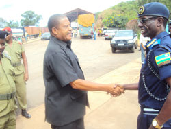 ACP Sam Karemera (L) greets his counterpart SACP Henry Salewi at Rusumo border. (Photo  S. Rwembeho.).