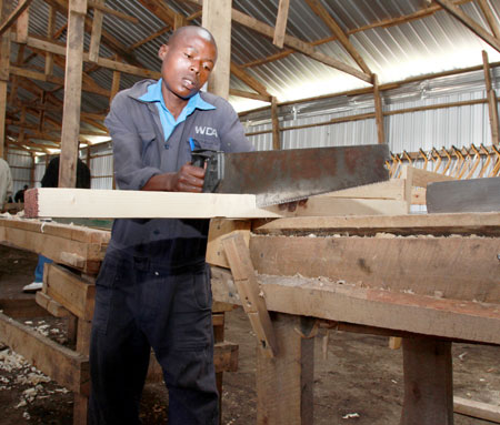 A student in a carpentry workshop