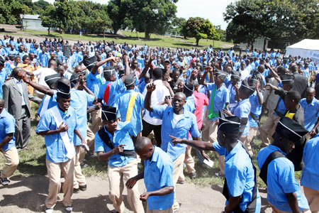 Students dance to the beats of with Patrick Bibarwa Kitoko during the ceremony