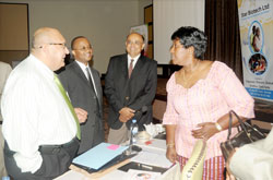 Health Minister Dr. Agnes Binagwaho (R)  shares a lighthearted moment with gynaecologists attending the infertility management  conference. (Photo J Mbanda)