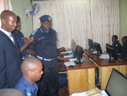 Minister Harerimana and Police chief Gasana tour the new traffic IT facilities. (Courtesy Photo)