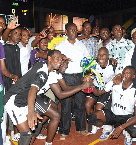 APR players with their trophy alongside Prime Minister Bernard Makuza.(Photo / J. Mbanda)