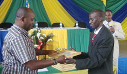 Rugabano Sector Executive Secretary Cyriaque Niyonsaba (R) was honoured for his tremendous achievements (Photo; S. Nkurunziza)
