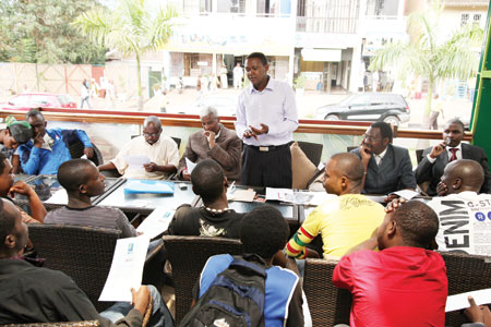 Alfred Mutua (standing), speaking at the press conference. (Photo: T. Kisambira)