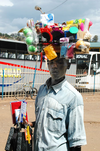 A hawker trades his wares in a Kigali street (File Photo)
