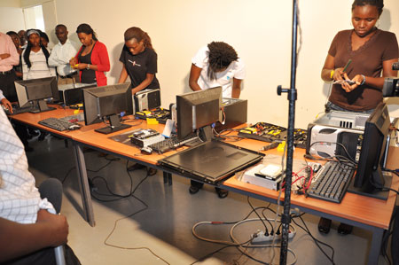 The best performing girls in last year's Senior Six national exams demonstrate their newly acquired  IT skills after completing the Imbuto Foundation training (Photo; F.)
