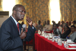 Labour Minister Anastase Murekezi addresses human resource personnel during the workshop (Photo; T. Kisambira)