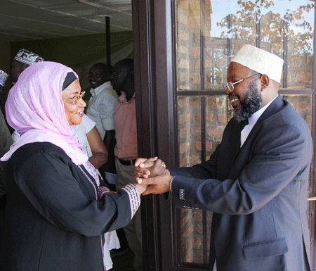  (L-R) MPSaidat Mukanoheri congratulates the new Mufti,  Abdul Karim Gahutu, after the Muslim elections held yesterday in Kigali (Photo T.Kisambira)