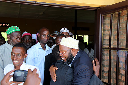 Muslims congratulate their new Mufti Abdul Karim Gahutu (R) after his election on Friday. (Photo T Kisambira)