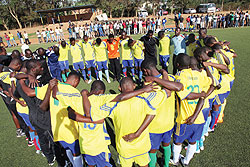 COMMON PRACTICE; Amavubi players and coaching staff saying a prayer after a training session early this week. Rwanda plays Burundi this afternoon in Bujumbura. (Photo; T. Kisambira)