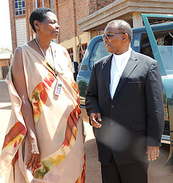 Bishop Phillip Rukamba (R) chats with Elizabeth Rugina outside Regina Pacis Church in Remera after the mass in honour the Late Bishop Aloys Bigirumwami (Photo J Mbanda)
