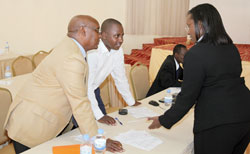 Caroline Kayonga the PS of MINIRENA (R), her lands counterpart Dr Emmanuel Nkurunziza (C) chat with Frank Rutabingwa, the officer in charge of forestry (Photo T.Kisambira)