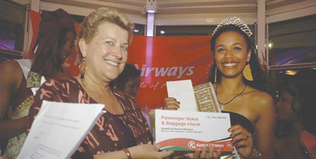 Kenya Airways France Country Manager Greta Swings (left) presents the winning prize of Miss East Africa Paris. (Net photo).
