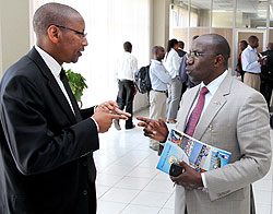 Finance Minister John Rwangombwa and Education Minister Pierre Damien Habumuremyi after the press conference yesterday (Photo J Mbanda)