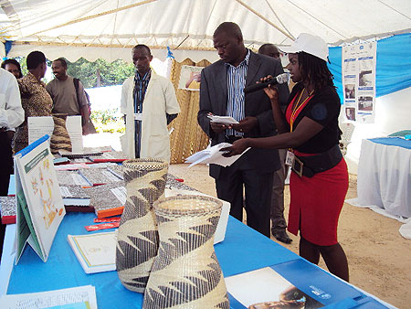 Mayor of Ngororero district, Gideon Ruboneza (C) inspects ICAP activities-one of the district  of development partners.(Photo D Sabiiti.)