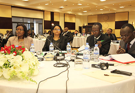 EAC Minister, Monique Mukaruliza (L) and Deputy Chief Justice Prof Sam Rugege at the IPR conference in Kigali (Photo T Kisambira)