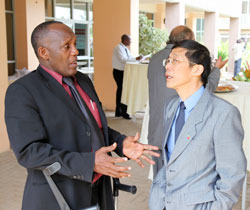 Hon Pierre Claver Rwaka, chats with the Chinese Ambassador, Shu Zhan, during the break (Photo T.Kisambira)