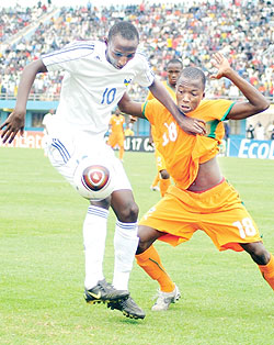 Andrew Buteera holds off an Ivory Coast player during the Caf U-17 Championship. He was one of the scorers on Thursday night. (File photo)
