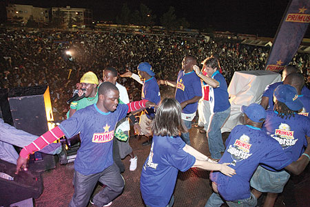 TAKING CENTRE STAGE: Primus Guma Guma team join singer Riderman (clad in a green T-shirt) on stage.