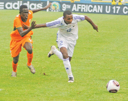 Mico (R) races to the ball during the Caf U-17 Championship. The striker is a doubt for Sundayu2019s game against England. (File photo)