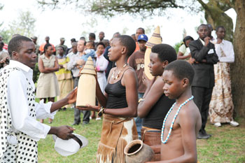 Children receive milk from the herdsman.
