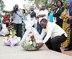 Vice Mayor of Kigali City, Alphonse Ndayisenga lays a wreath in honour of its 14 former employees killed during the Genocide (Photo T.Kisambira)