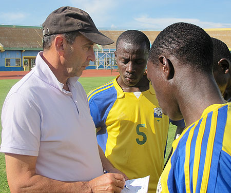 TIME TO DELIVER; Junior Wasps Coach Richard Tardy (L) passing on instructions to his players during a training session. (File Photo)
