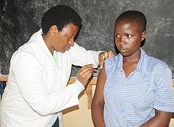 A school girl receives a cervical cancer vaccination jab. The vaccination campaign achieved 97 percent (File Photo).
