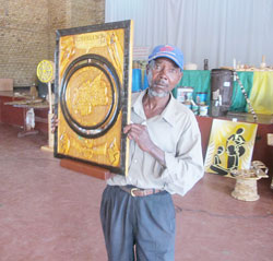 Abdul Niyonemera displays his winning art piece during the provincial level contest