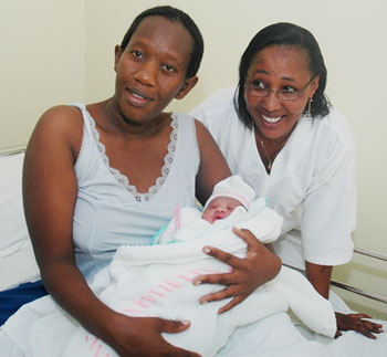 Rwandan mother, Solange Uwamahoro with Midwife Emmeliene Mukandoli  at Croix du Sud Hospital, Kigali. According to a new report, globally, 350,000 midwives are still lacking. (File Photo)
