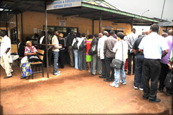  Passengers queue at Gatuna border post. The new immigration law will ease movement of East Africans (File Photo)